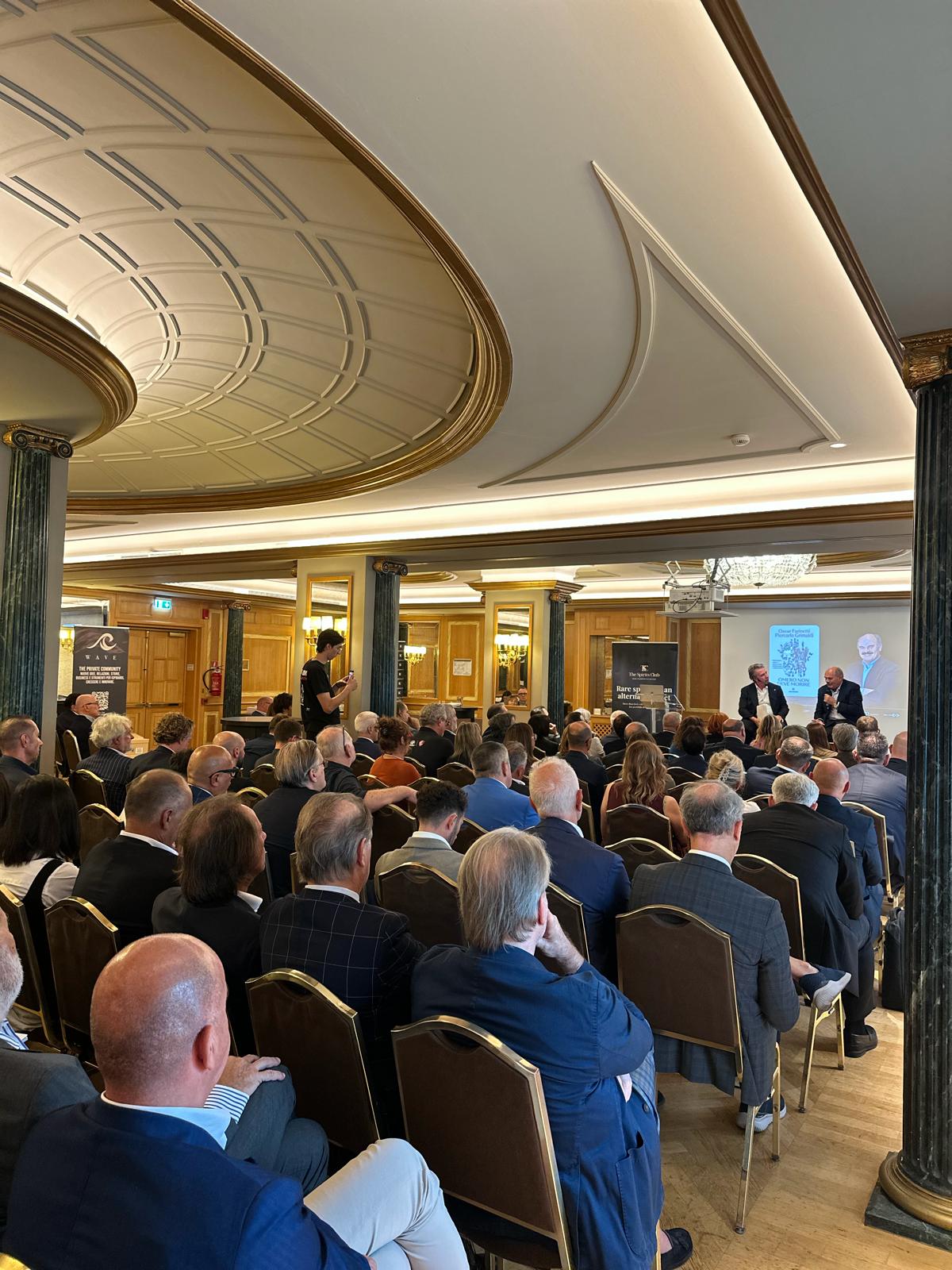 Wave · Our latest event — wide room and stage